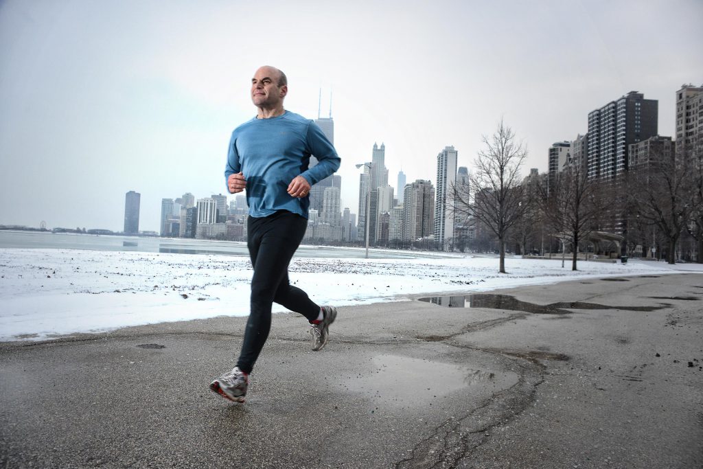 middle-age-man-running-in-park-in-winter.png