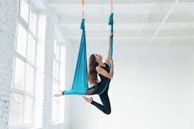 female hanging on silk fabric dance posing